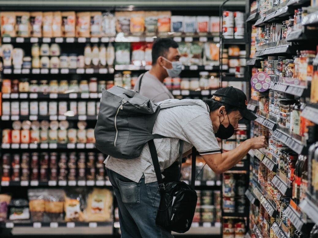 Shopper looking at products on-shelf