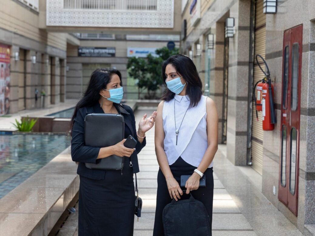 Concept image of businesswomen wearing Covid-19 masks
