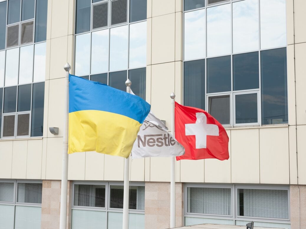 Ukraine, Nestle and Switzerland flags in Lviv, Ukraine, 31 July 2021