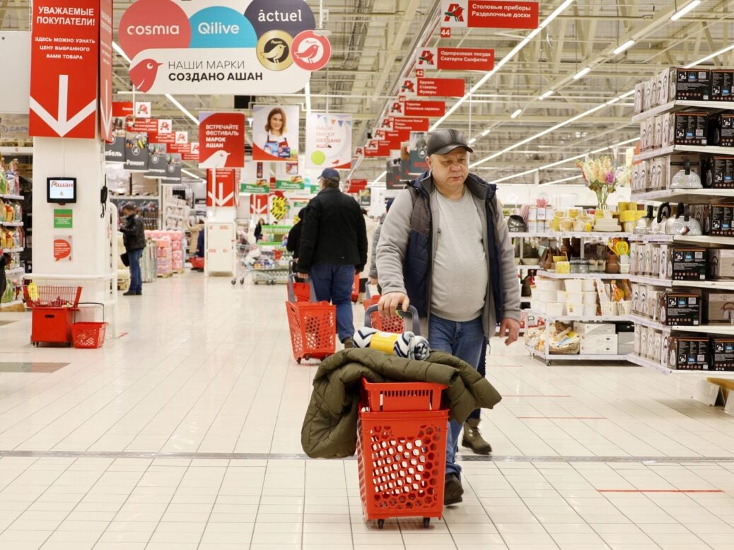 Man shopping in Auchan store, Moscow, Russia, March 2022