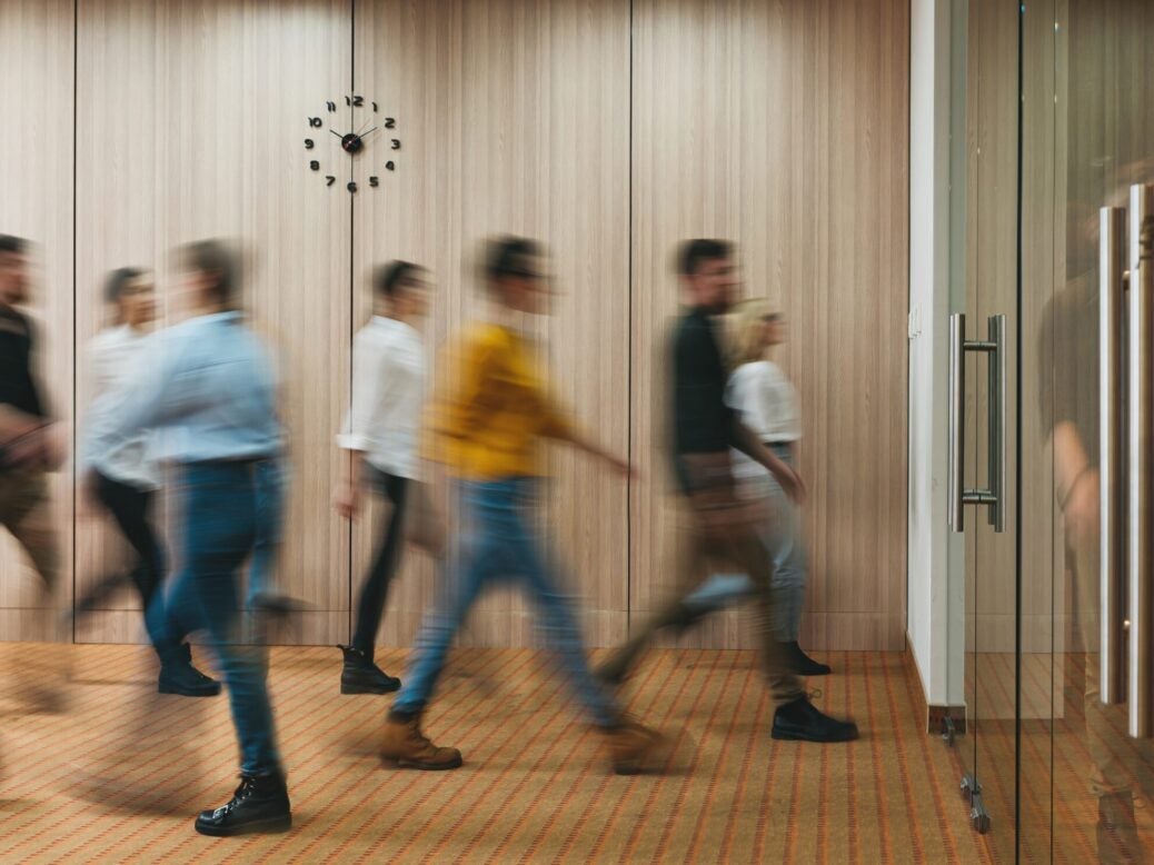 Concept image of people walking in office building