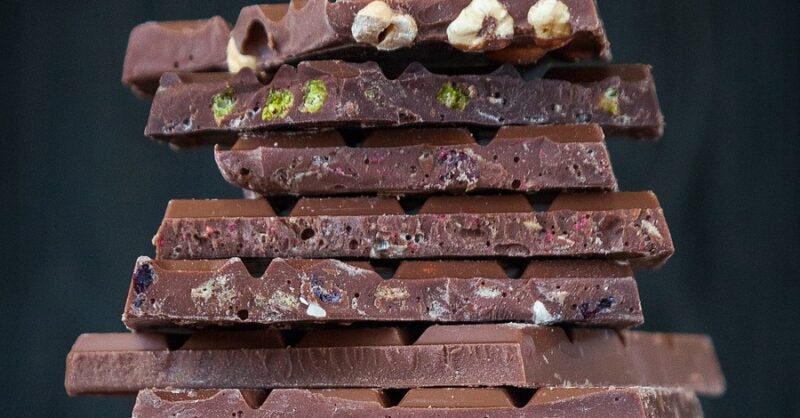 The impact of inflation on indulgent snacks like chocolate, crisps - Vimarsana News