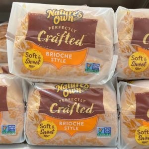 Nature's Own Perfectly Crafted Thick Sliced Brioche Style Bread loaves on the shelf in a supermarket.