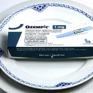 Ozempic injection pen on a plate