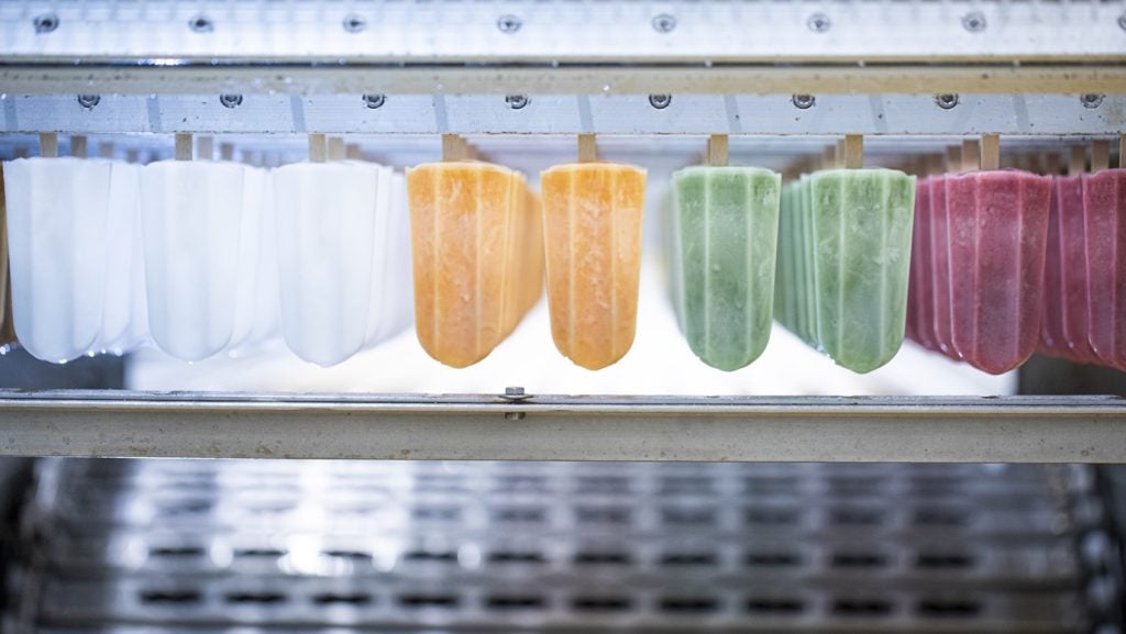 Iced fruit lollies on production line