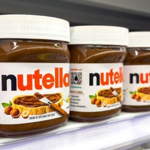 Jars of Nutella hazelnut cocoa spread on display in the food section of a supermarket.